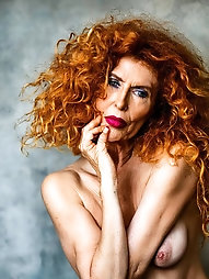 Grannies Nude Pics: Portrait of a Red Haired Woman with Orange Skin and Long Fiery Hair
